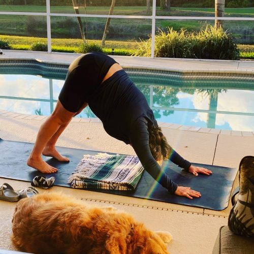 Julie on her Yoga Mat in the Downward Dog pose.